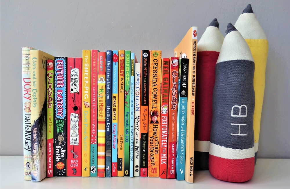 Row of books with pencil shaped bookend