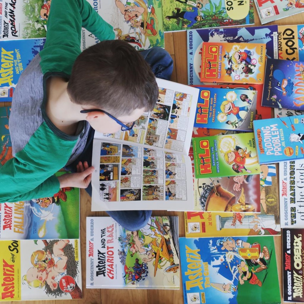 Boy reading graphic novels